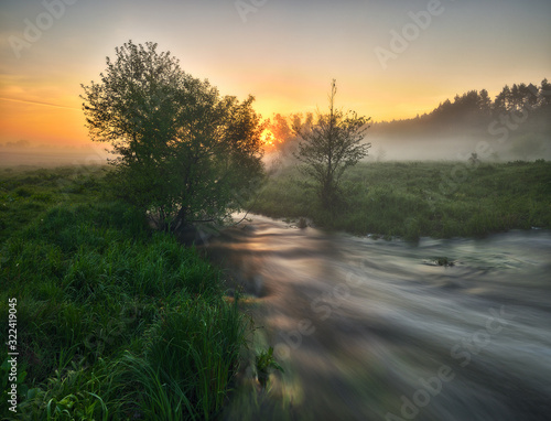 Dawn in the river valley. morning fog