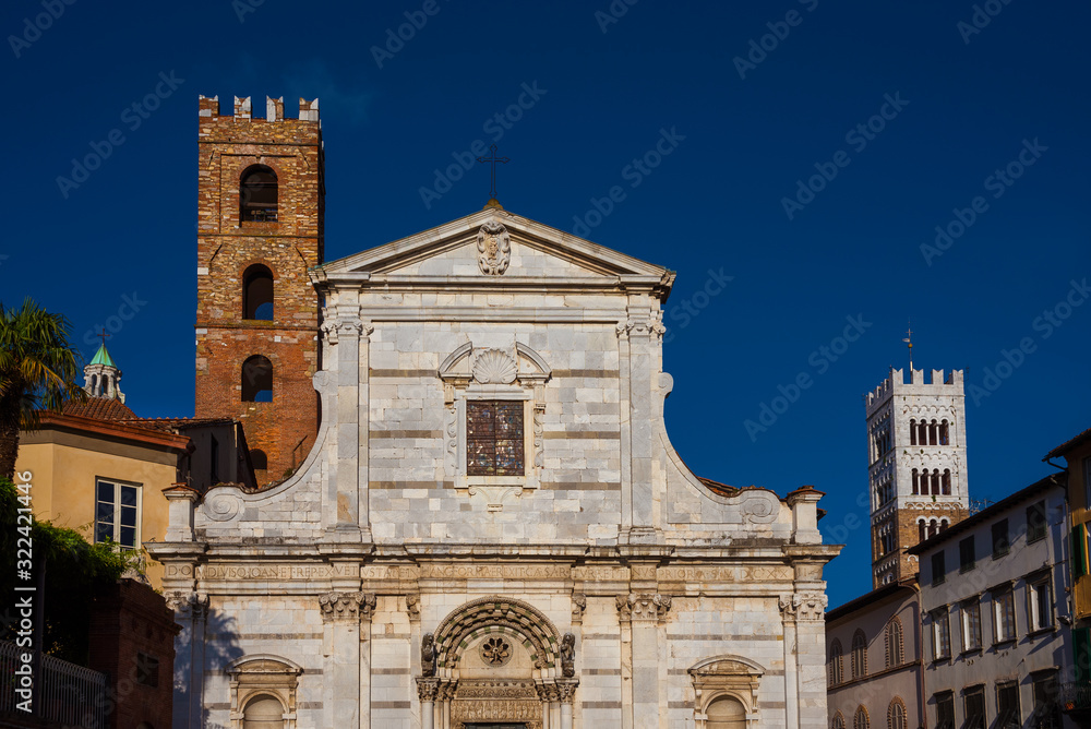 Old medieval churches in Lucca historic center with ancient bell towers