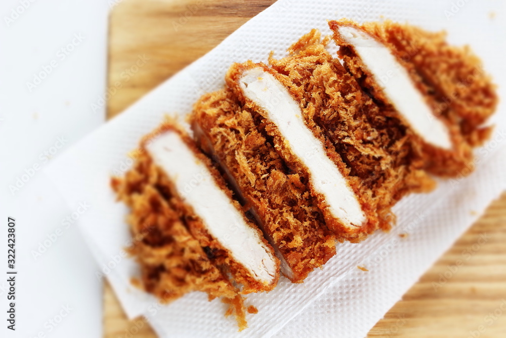 Japanese food, pork cutlet Tonkatsu on board Japanese food, pork cutlet Tonkatsu on board
