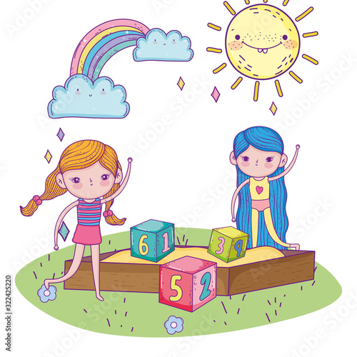happy childrens day, girls in sandbox with numbers blocks park