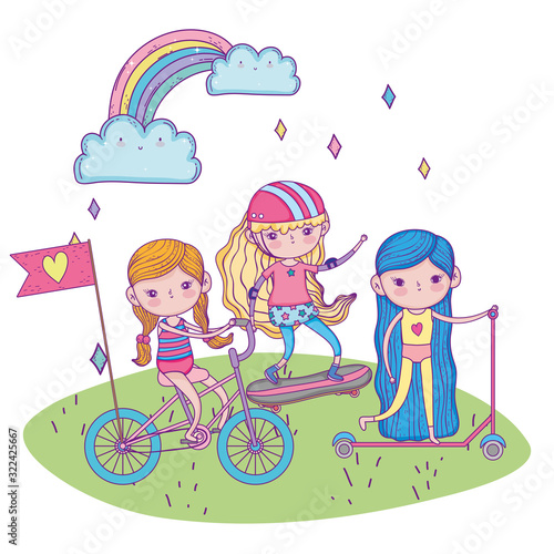 happy childrens day, little girls with scooter bike and skateboard in the park