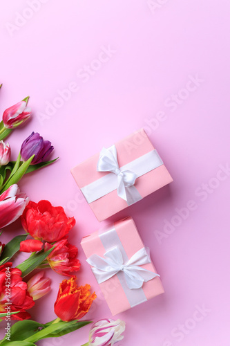 Spring creative holiday present. Handmade paper gift box with floral decorations on pink. Mother's day, spring background. Copy space © Vadym