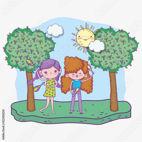 happy childrens day, girls singing with maracas instruments in park