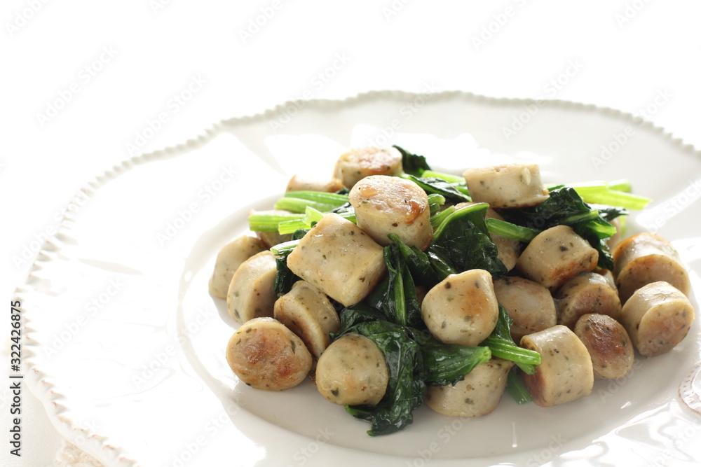 Asian food, herbal sausage and spinach sautéed Asian food, herbal sausage and spinach sautéed