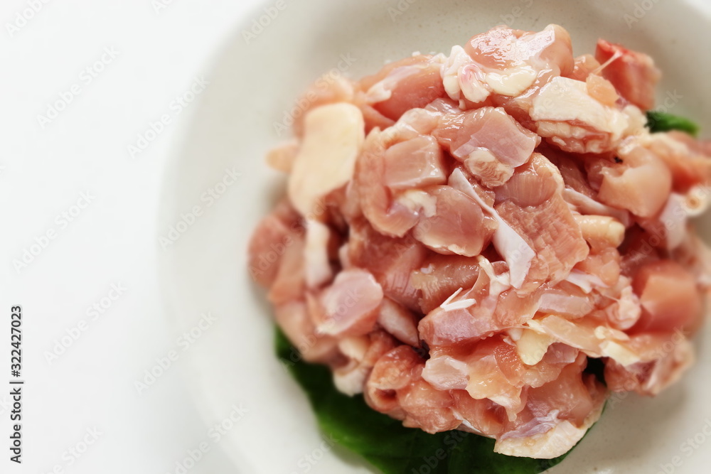 Chopped chicken on dish for prepared ingredient Chopped chicken on dish for prepared ingredient