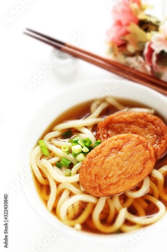 Japanese food, satsuma-age fish cake and Udon noodles with green onion in broth soup