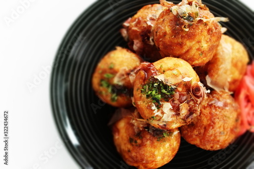 Japanese food, takoyaki octopus ball on dish and sauce