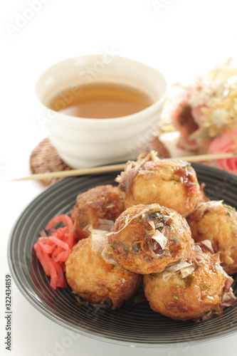 Japanese food, takoyaki octopus ball on dish and sauce
