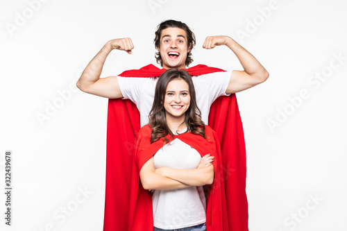Young pretty couple in red hero look showing arm muscle isolated on white background