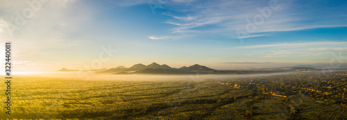 Panorama image from a drone of fog in the Sonoran Desert of Arizona during sunrise.
