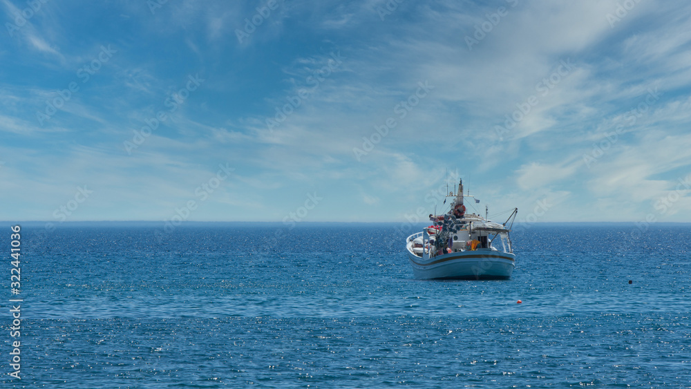 Greek fishing boat at anchor off the coast of Lesvos Greek fishing boat at anchor off the coast of Lesvos