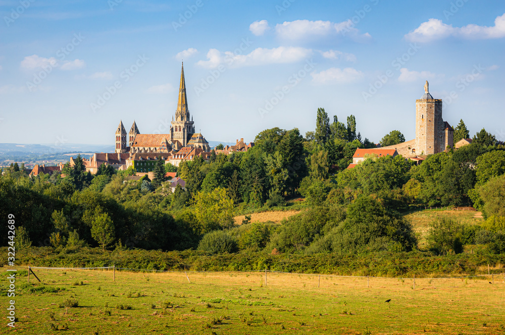 Scenic panoramic view of historic old town of Autun with famous Cathedrale Saint-Lazare d'Autun on top of a hill in beautiful golden evening light at sunset in summer, Saone-et-Loire, Burgundy, France Scenic panoramic view of historic old town of Autun with famous Cathedrale Saint-Lazare d'Autun on top of a hill in beautiful golden evening light at sunset in summer, Saone-et-Loire, Burgundy, France