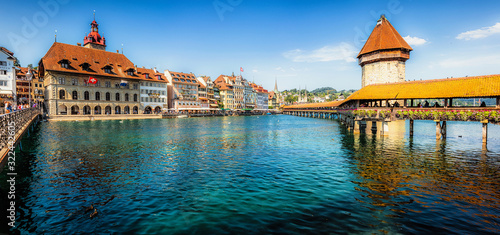 Scenic panoramic view of famous Chapel Bridge in the historic city center of Lucerne, one of Switzerland's main tourist attractions on a beautiful sunny day in summer, Canton of Lucerne, Switzerland