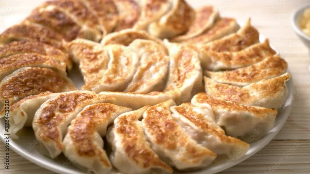 fried gyoza or dumplings snack with soy sauce in Japanese style fried gyoza or dumplings snack with soy sauce in Japanese style