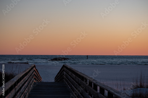 beach boardwalk sunset glow © Sue