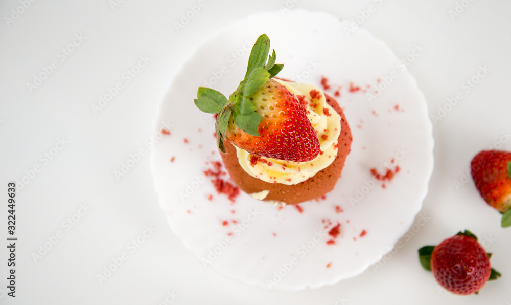 strawberries and cream on a white plate strawberries and cream on a white plate