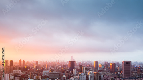 Landscape of blur image city skyline at sunset for background