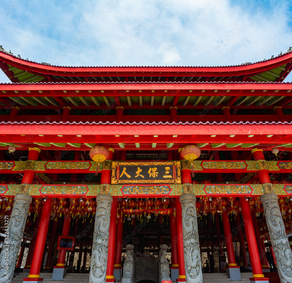 Semarang, Indonesia - CIRCA Nov 2019: The roof and facade of the main temple in Sam Po Kong (Gedung Batu) temple complex. It is dedicated to Zheng He, a Moslem chinese admiral. Semarang, Indonesia - CIRCA Nov 2019: The roof and facade of the main temple in Sam Po Kong (Gedung Batu) temple complex. It is dedicated to Zheng He, a Moslem chinese admiral.