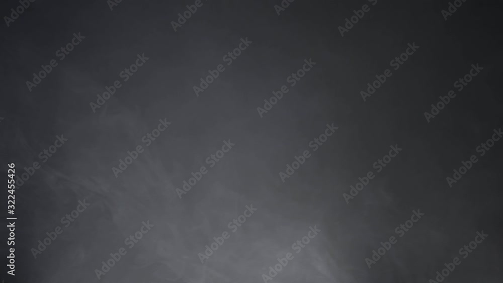 Abstract white smoke in slow motion. Smoke, Cloud of cold fog in light spot background. Light, white, fog, cloud, black background, 4k, ice smoke cloud. Floating fog. Abstract white smoke in slow motion. Smoke, Cloud of cold fog in light spot background. Light, white, fog, cloud, black background, 4k, ice smoke cloud. Floating fog.