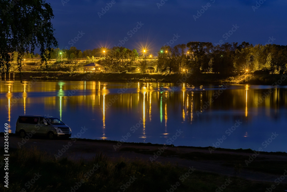 Night Landscape with river coast and street  lights on the coast line.