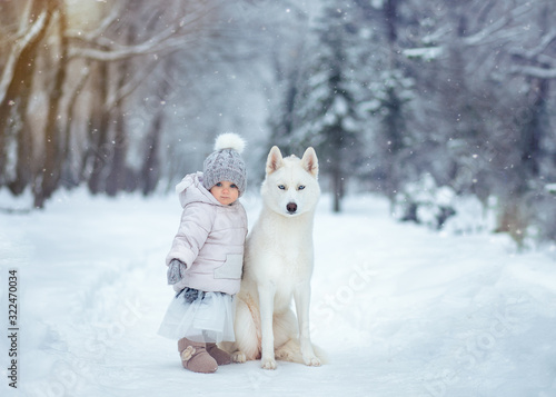 girl and dog in snow
