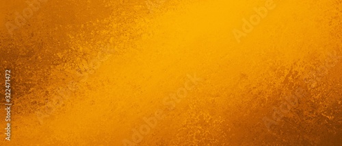 Orange background texture in bright yellow gold and orange lava color splash design  abstract hot fiery grunge in dramatic glowing center with brown corner borders