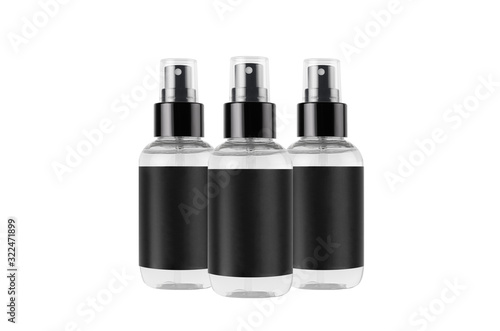 Transparent spray bottles for cosmetics product with black blank label isolated on white background, mock up for branding, advertising, design.