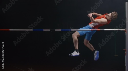 Slow motion: Athlete Doing High Jump success photo