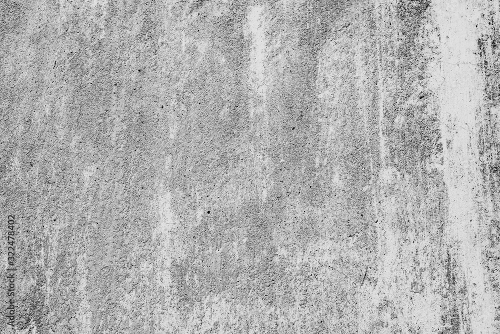 Fototapeta premium Texture of a concrete wall with cracks and scratches which can be used as a background