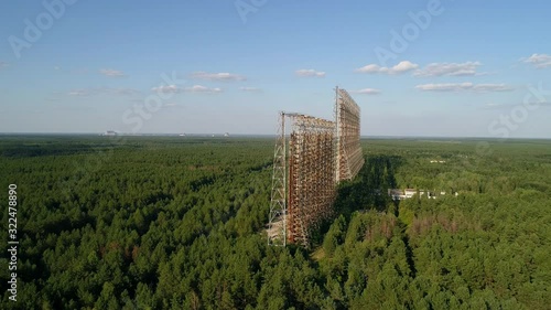 Aerial view of the DUGA radar station near the city of Chernobyl-2 among the forest. Exclusion Zone. 4K drone footage. photo