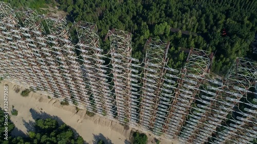 Aerial view of the DUGA radar station near the city of Chernobyl-2 among the forest. Exclusion Zone. 4K drone footage. photo