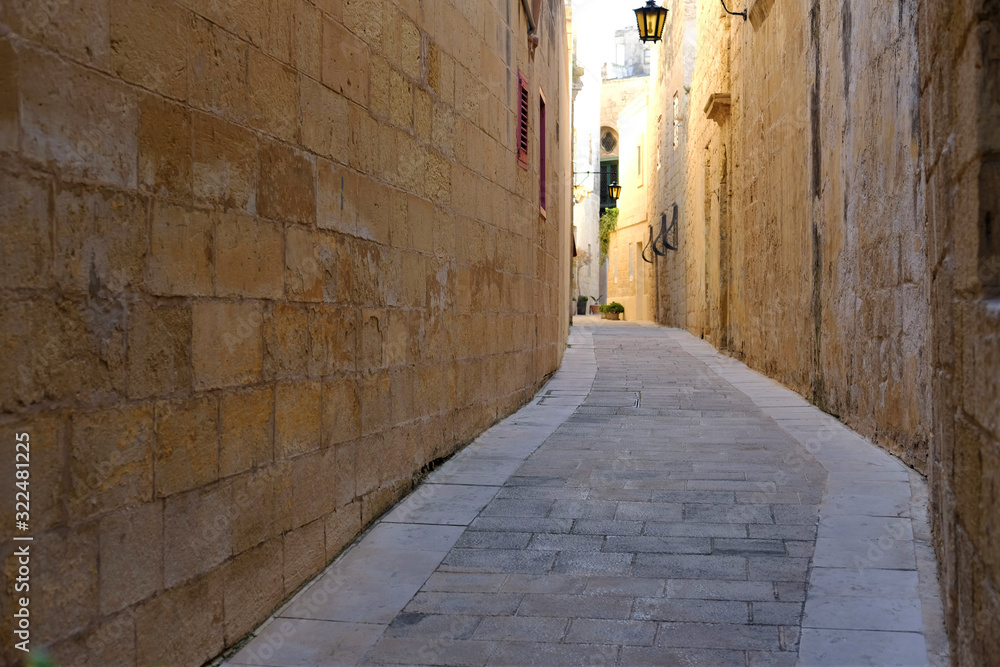 narrow ancient street in Mdina, Malta