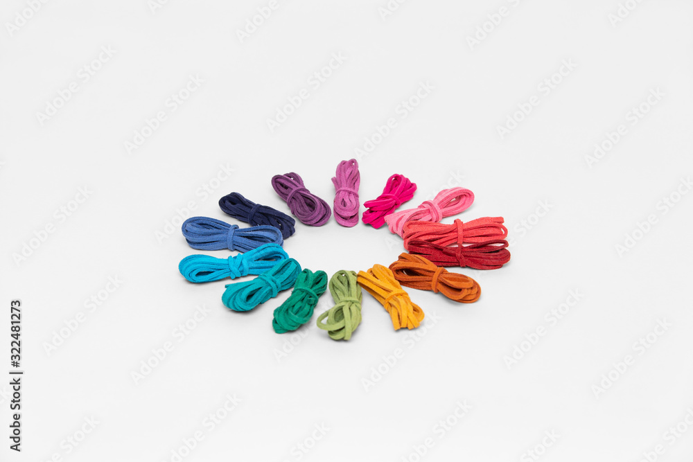 collection of various strings on white background. colorful threads. bundle of chamois string.
