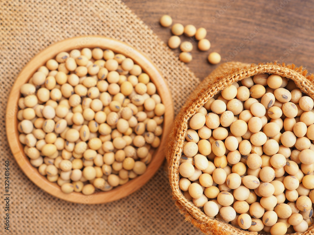 Top view soybeans in sackcloth bag on wooden background, Protein plant health food.. Top view soybeans in sackcloth bag on wooden background, Protein plant health food..