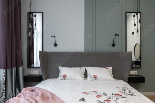 bedroom with a large bed  white linen  lots of air  Scandinavian design.