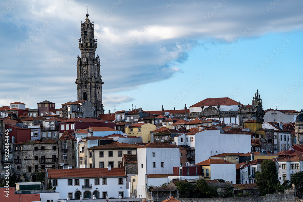 Viewpoint of the red clay rooftops and tower of the Clerigos Church (Baroque style church with bell tower) in Porto Portugal