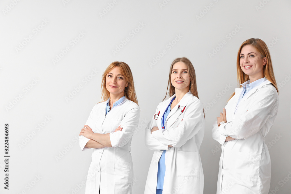 Portrait of female doctors on light background Portrait of female doctors on light background