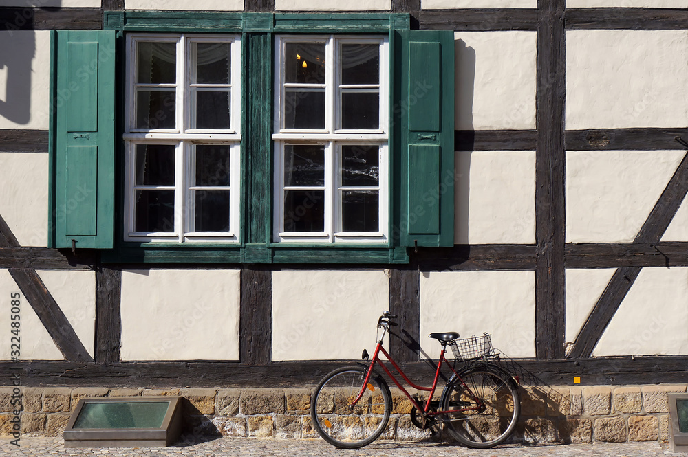 Bicycle in front of old half-timbered house in Quedlinburg, Germany.