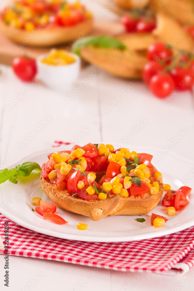 Friselle with tomatoes and mais. Friselle with tomatoes and mais.