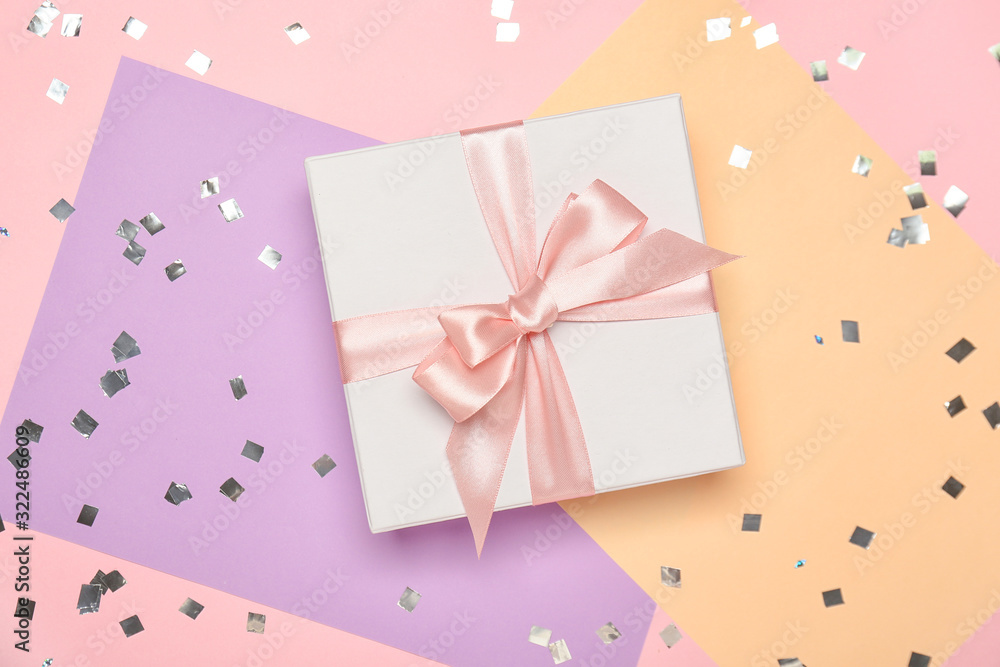 Beautiful gift box on color background