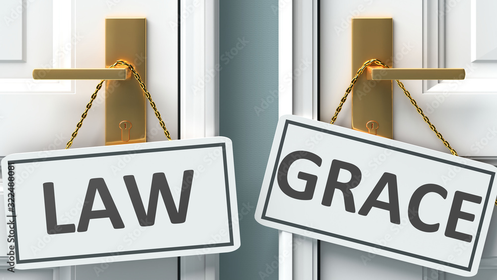 Law or grace as a choice in life pictured as words Law, grace on