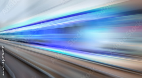High speed train runs on rail tracks . Train in motion.