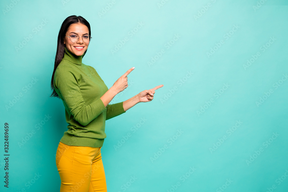 Profile side view portrait of her she nice attractive lovely pretty cute cheerful girl demonstrating ad advert copy space isolated over bright vivid shine vibrant blue green turquoise color background Profile side view portrait of her she nice attractive lovely pretty cute cheerful girl demonstrating ad advert copy space isolated over bright vivid shine vibrant blue green turquoise color background
