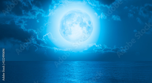 Night sky with moon in the clouds  Elements of this image furnished by NASA