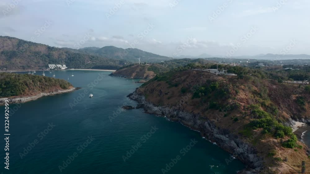 Aerial view of the Promthep Cape on the south of Phuket island in Thailand. Orbiting around southernmost tip of Phuket island. Aerial view of the Promthep Cape on the south of Phuket island in Thailand. Orbiting around southernmost tip of Phuket island.