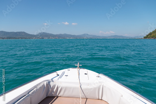 In front of speed boat while sailing to the island in Thailand with calm sea wave © TeeRaiden