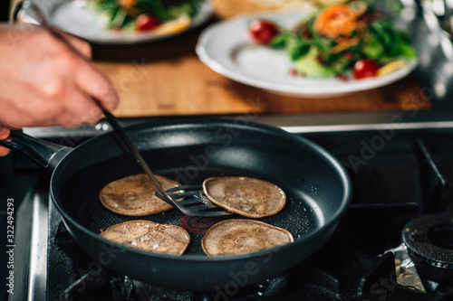 Chef Frying Dough in Pan