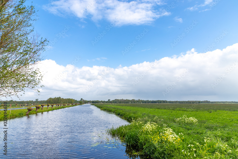 Rural landscape, water canals in the vicinity of Kinderdijk, the Netherlands Rural landscape, water canals in the vicinity of Kinderdijk, the Netherlands