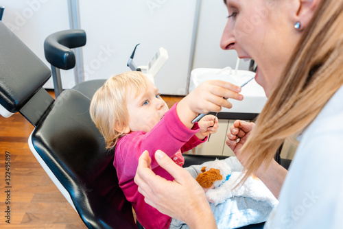 Child in the dentists office becoming comfortable