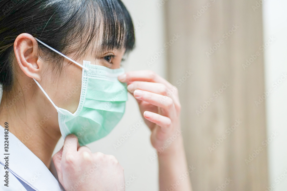 Close up Asian female physician wearing medical mask Close up Asian female physician wearing medical mask
